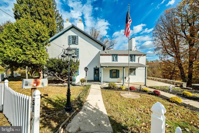 a bathroom with a sink a mirror and window