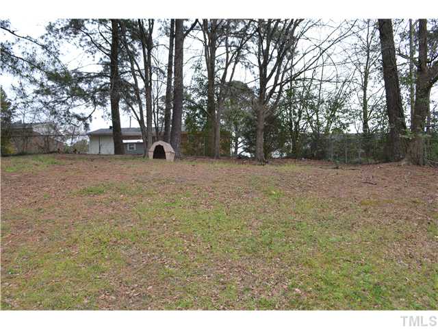 505 Solar Drive Raleigh, NC 27610 - Photo 16 of 16 a backyard of a house with lots of green space