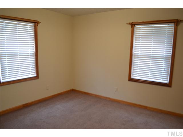 505 Solar Drive Raleigh, NC 27610 - Photo 8 of 16 a view of an empty room with a window