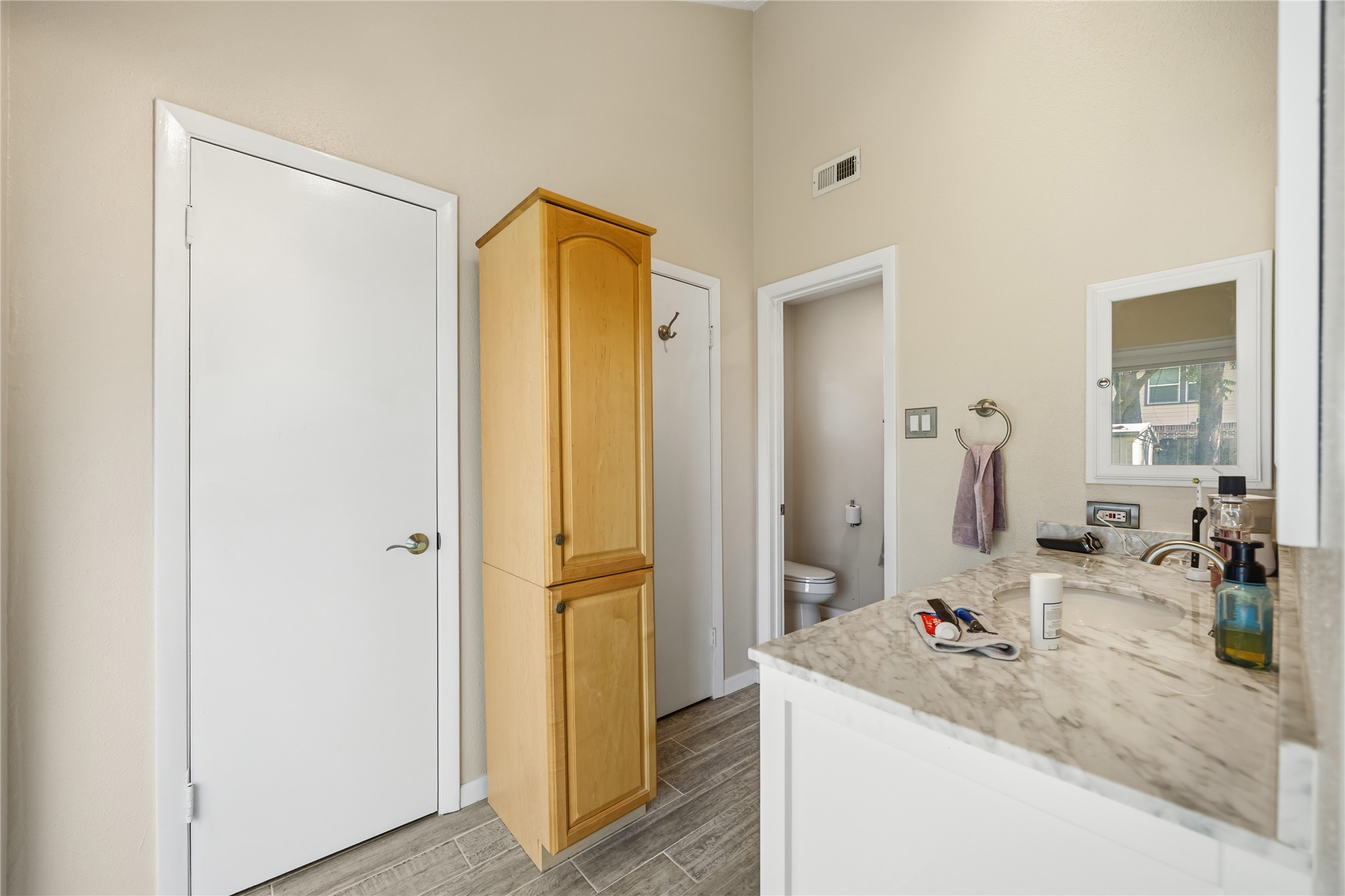 9635 Birsay Street Spring, TX 77379 - Photo 20 of 24 a bathroom with a granite countertop sink and a mirror
