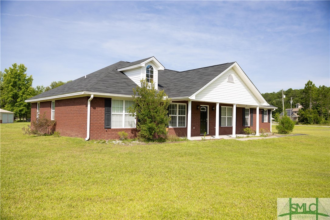 306 Main Trail Midway, GA 31320 - Photo 2 of 36 Left side of home