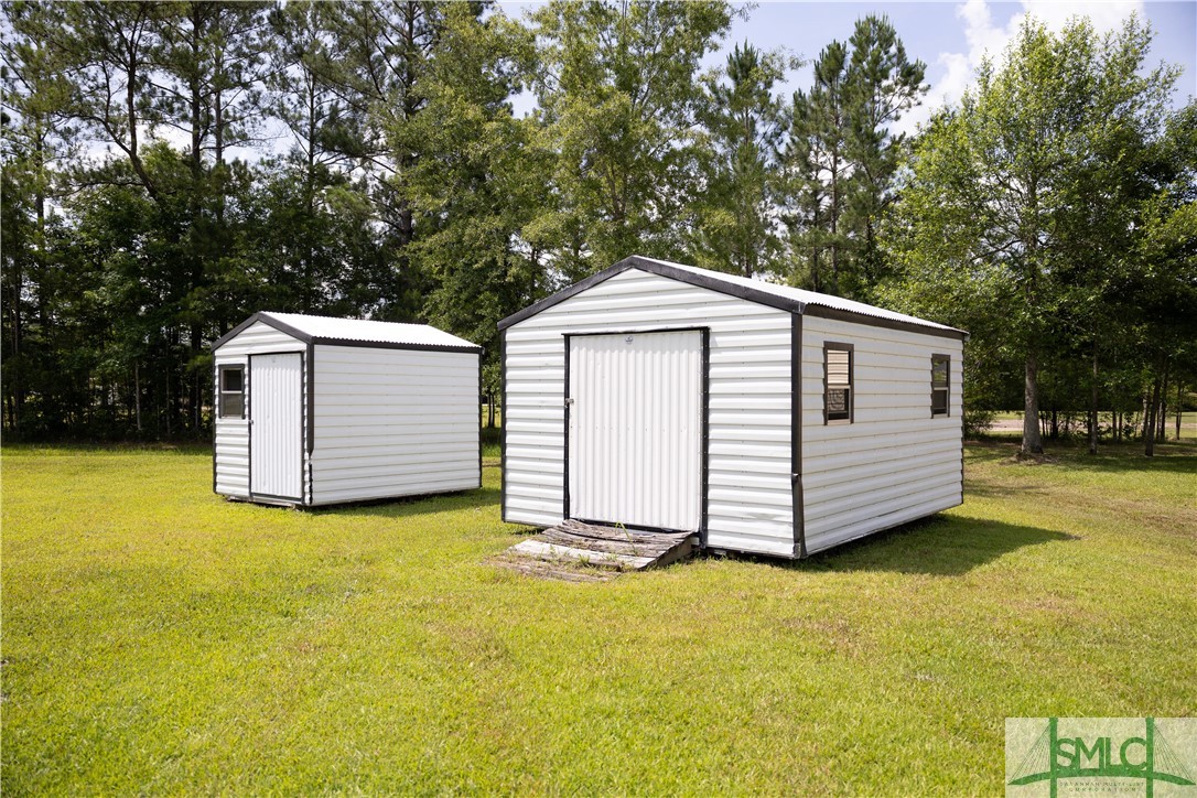 306 Main Trail Midway, GA 31320 - Photo 31 of 36 Storage sheds in the back yard