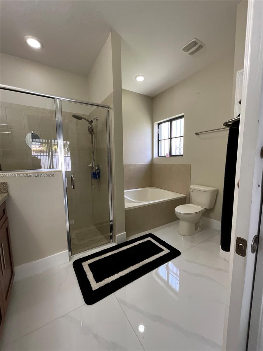 13201 Southwest 274th Terrace Homestead, FL 33032 - Photo 11 of 14 a bathroom with a sink a toilet a window and a mirror