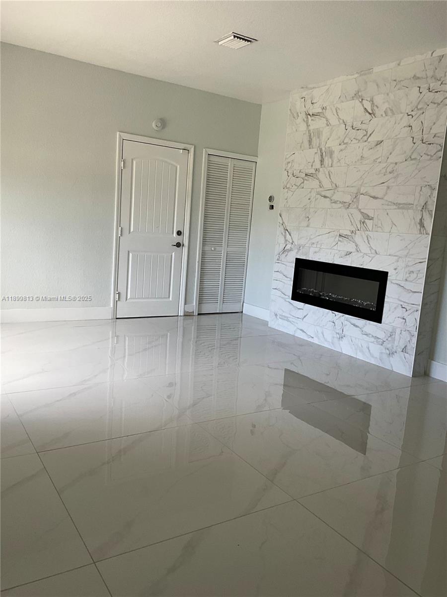 13201 Southwest 274th Terrace Homestead, FL 33032 - Photo 4 of 14 a view of a livingroom with wooden floor