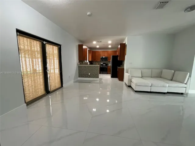 a view of livingroom with furniture and window