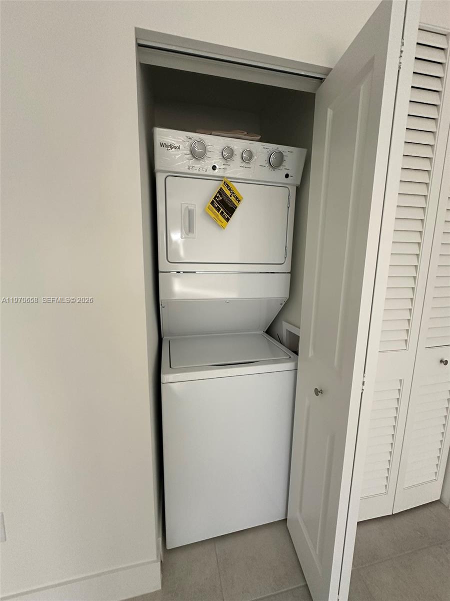 11278 Southwest 187th Street, Unit 11278 Miami, FL 33157 - Photo 6 of 16 a utility room with dryer and washer