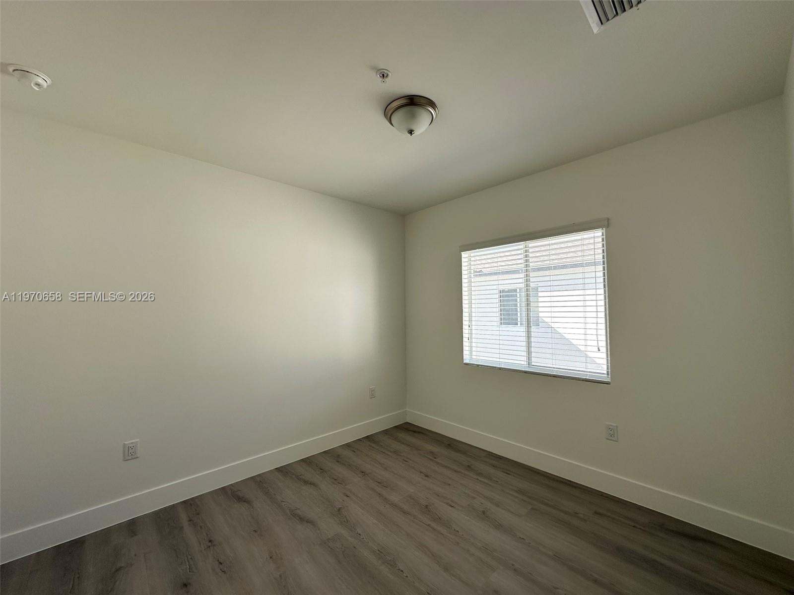 11278 Southwest 187th Street, Unit 11278 Miami, FL 33157 - Photo 7 of 16 an empty room with a window