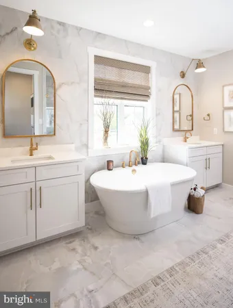 a spacious bathroom with a double vanity sink mirror and bathtub
