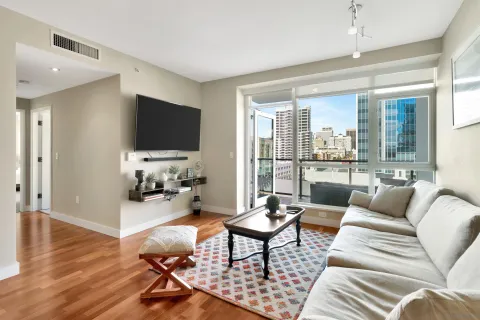 a living room with furniture and a flat screen tv