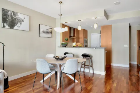 a view of a dining room with furniture and wooden floor