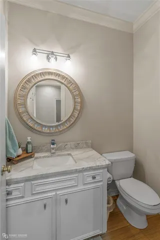 a bathroom with a toilet and a sink