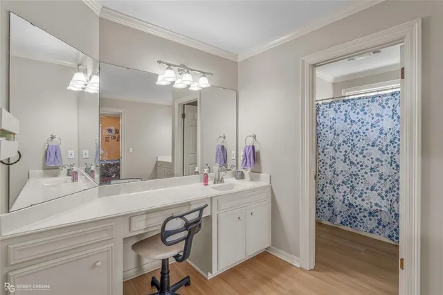 a bathroom with a sink double vanity and a mirror