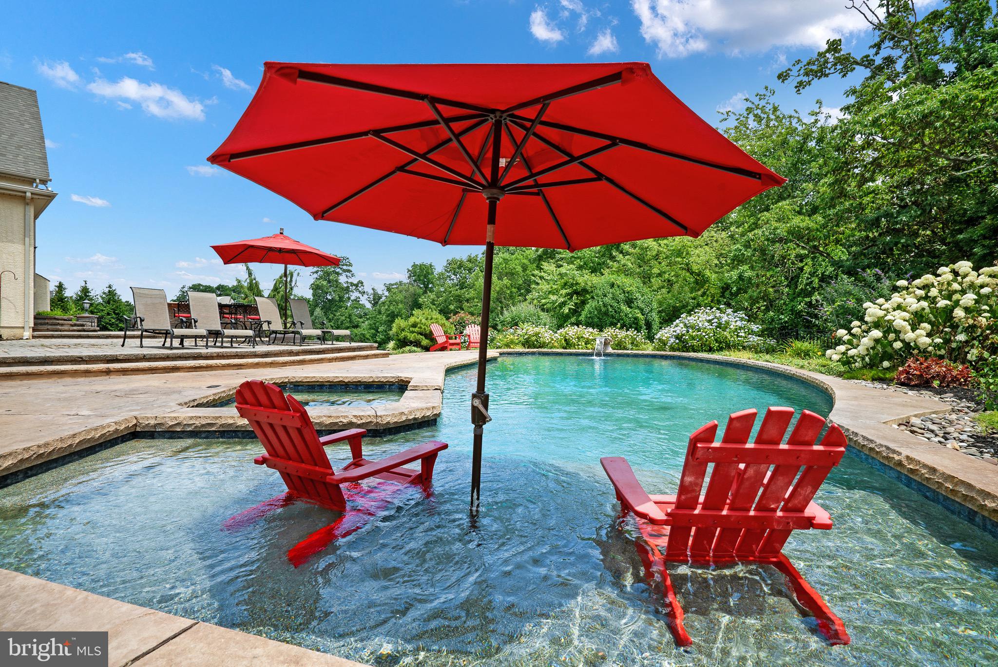 2221 Devin Lane Jamison, PA 18929 - Photo 5 of 12 an outdoor sitting area with furniture and umbrella