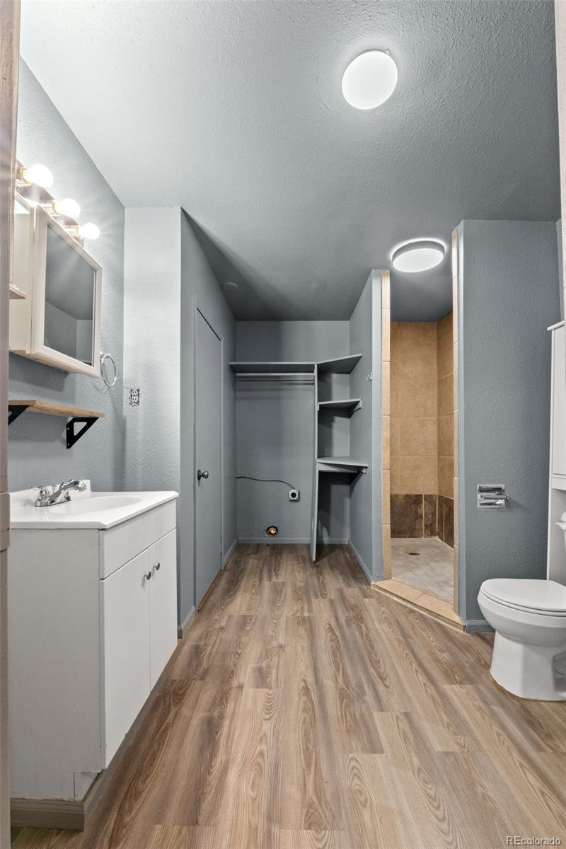 620 Hospital Road Brush, CO 80723 - Photo 19 of 24 a bathroom with a sink and a mirror