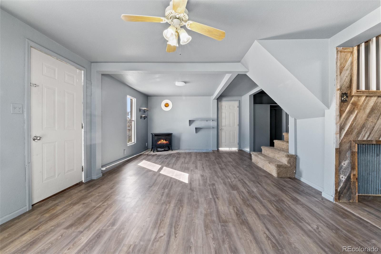 620 Hospital Road Brush, CO 80723 - Photo 8 of 24 a view of empty room with wooden floor and fan
