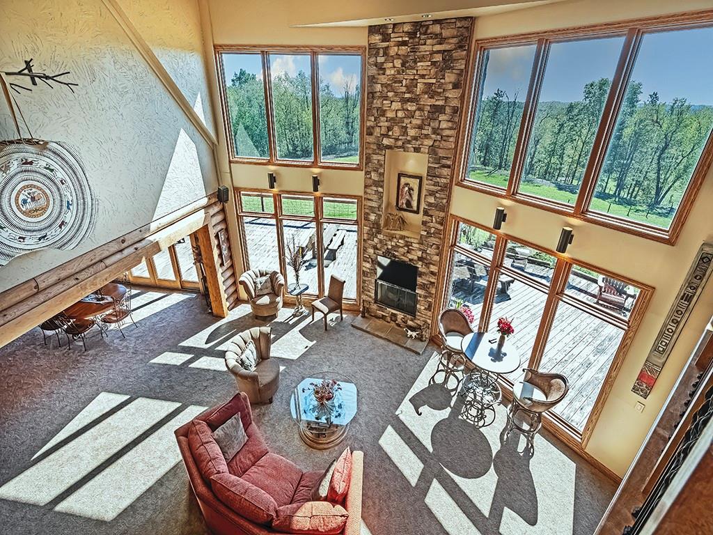 166 McKay Road Saxonburg, PA 16056 - Photo 11 of 48 a view of a living room with furniture and a floor to ceiling window