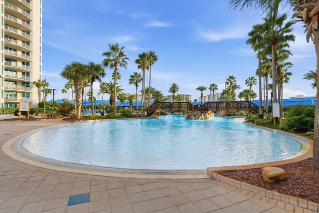 a building view with swimming pool and sitting space