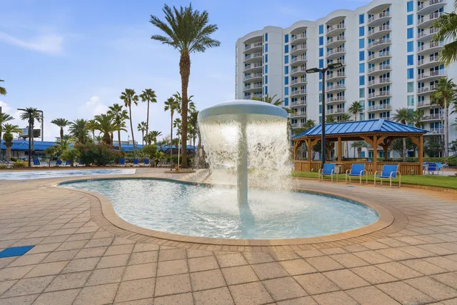 a front view of a building with outdoor seating