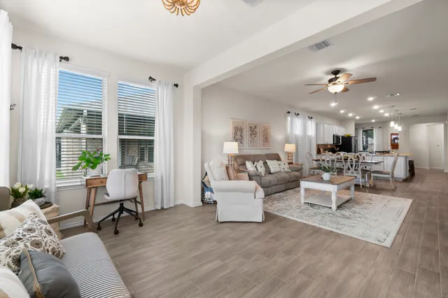 a living room with furniture and a large window