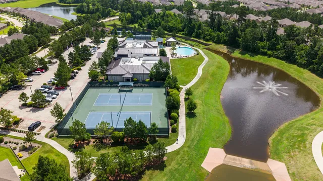 an aerial view of a house with a swimming pool