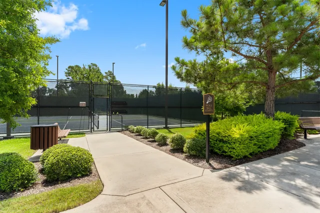 a view of a backyard with sitting area