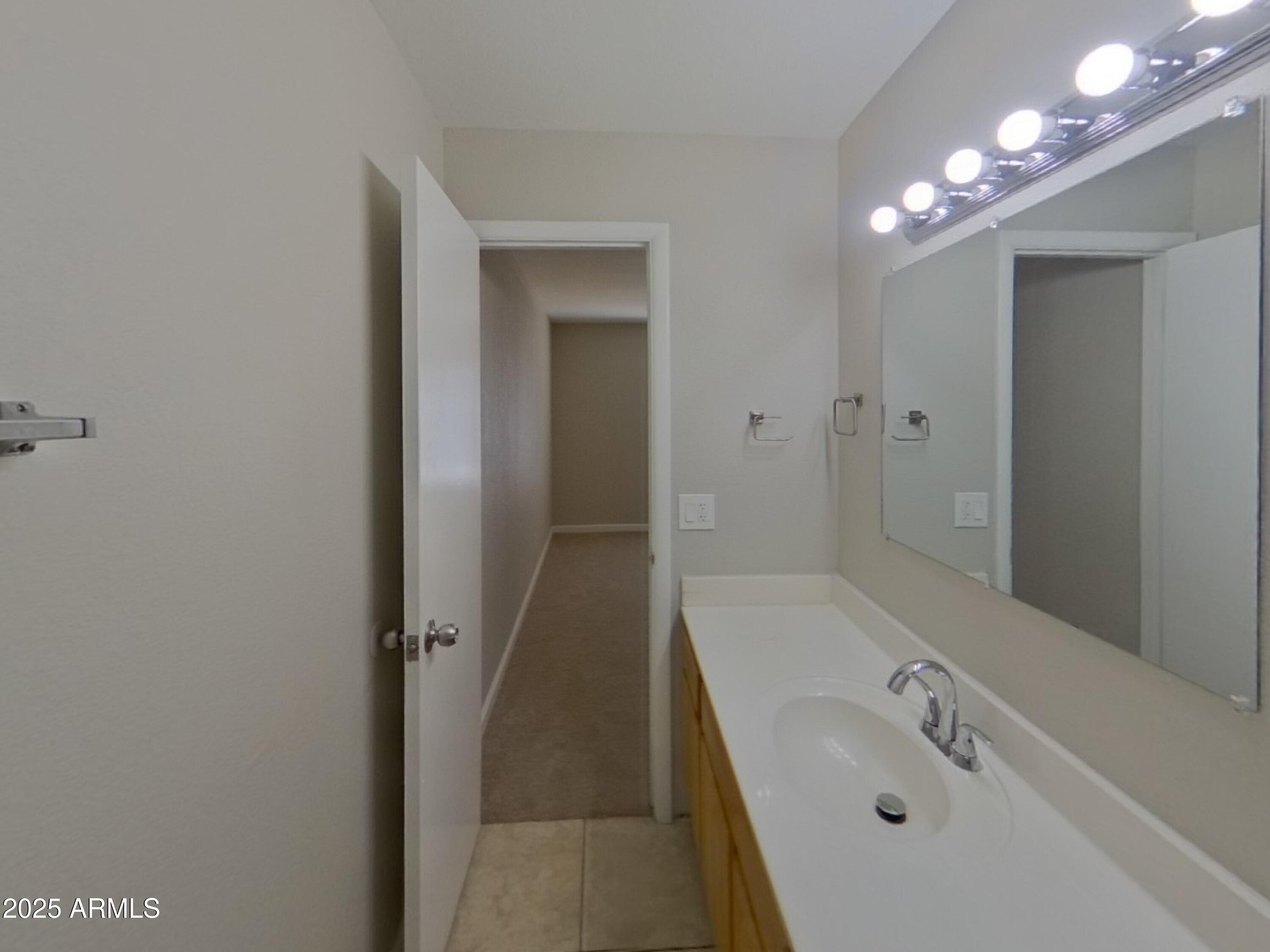 845 South Vineyard Mesa, AZ 85210 - Photo 13 of 26 a bathroom with a tub sink vanity and mirror