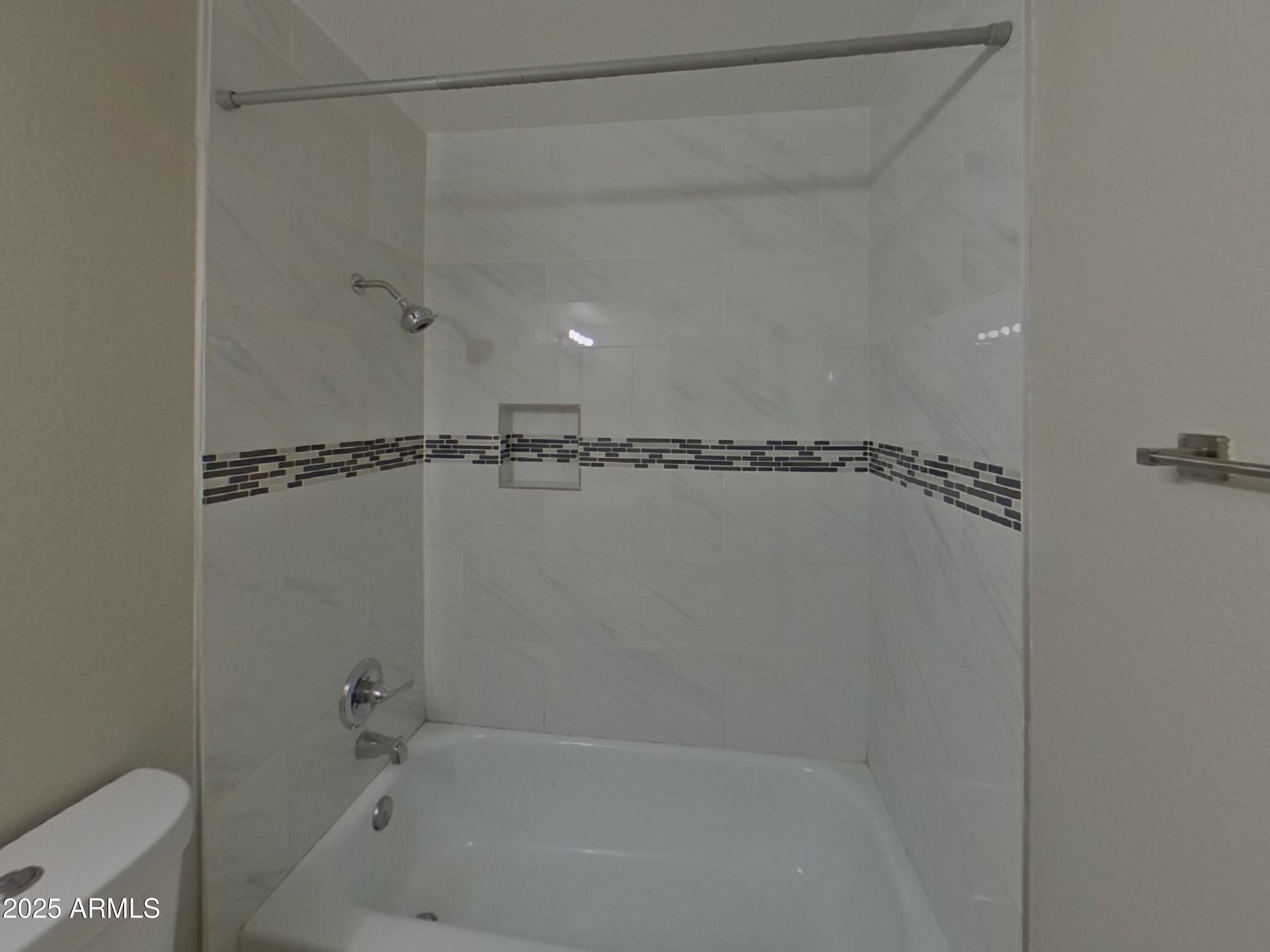 845 South Vineyard Mesa, AZ 85210 - Photo 21 of 26 a bathroom with a shower and a bath tub