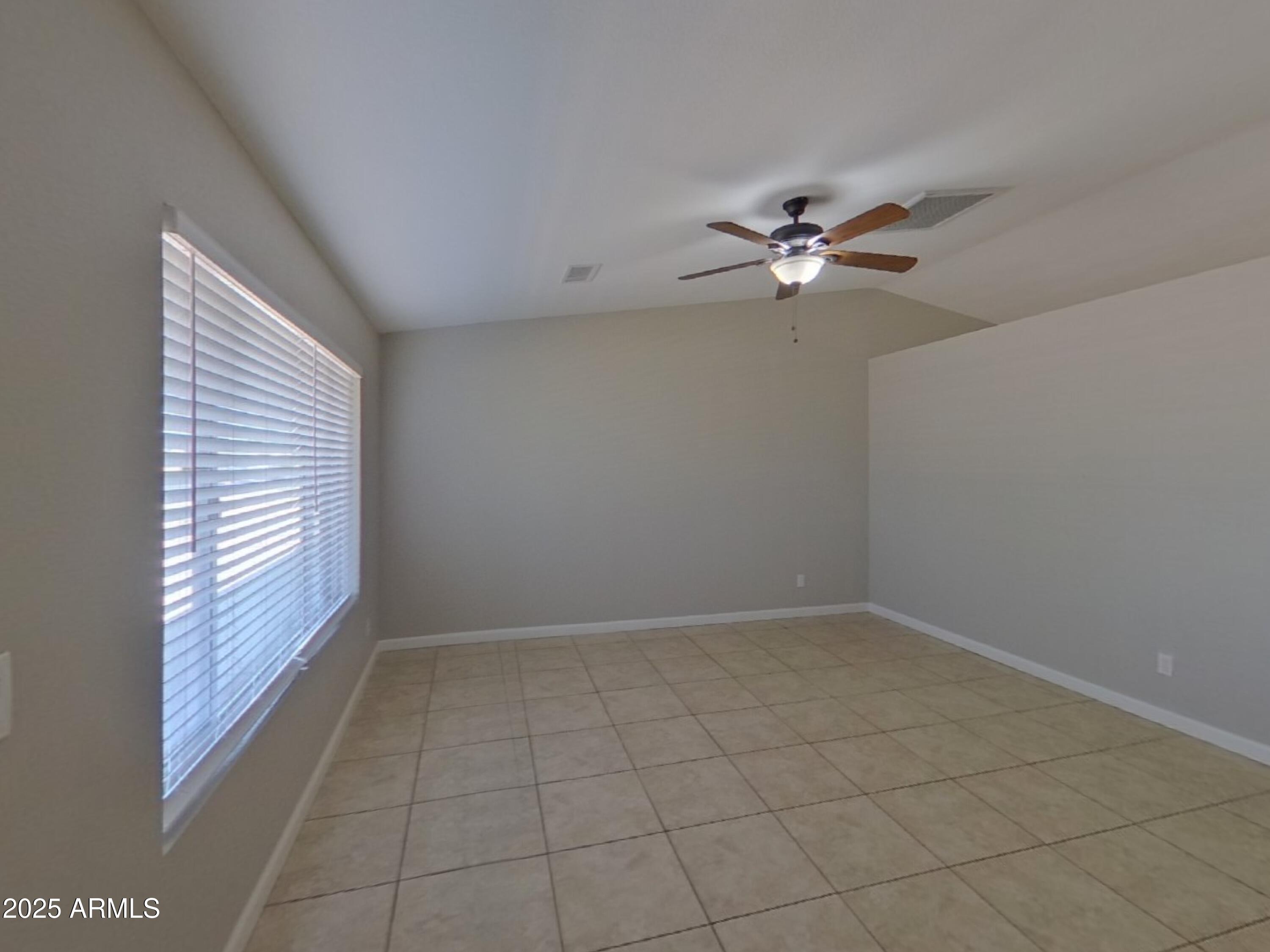 845 South Vineyard Mesa, AZ 85210 - Photo 4 of 26 an empty room with windows and fan