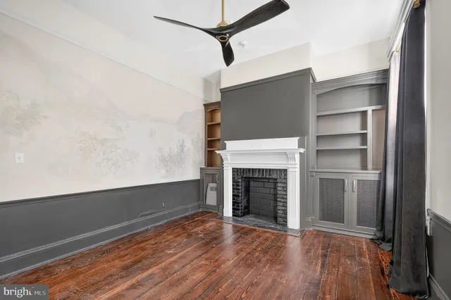 a kitchen with stainless steel appliances a stove a microwave and cabinets
