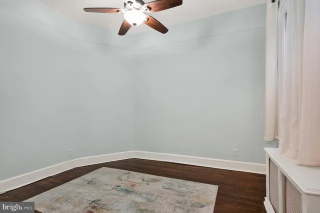 a bathroom with a sink mirror and shower