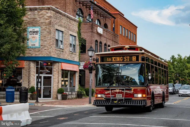 a view of a terrace with lawn chairs