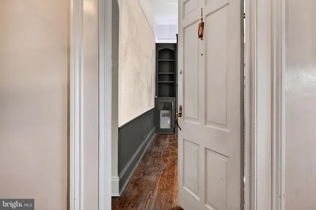 a living room with furniture fireplace and a large window