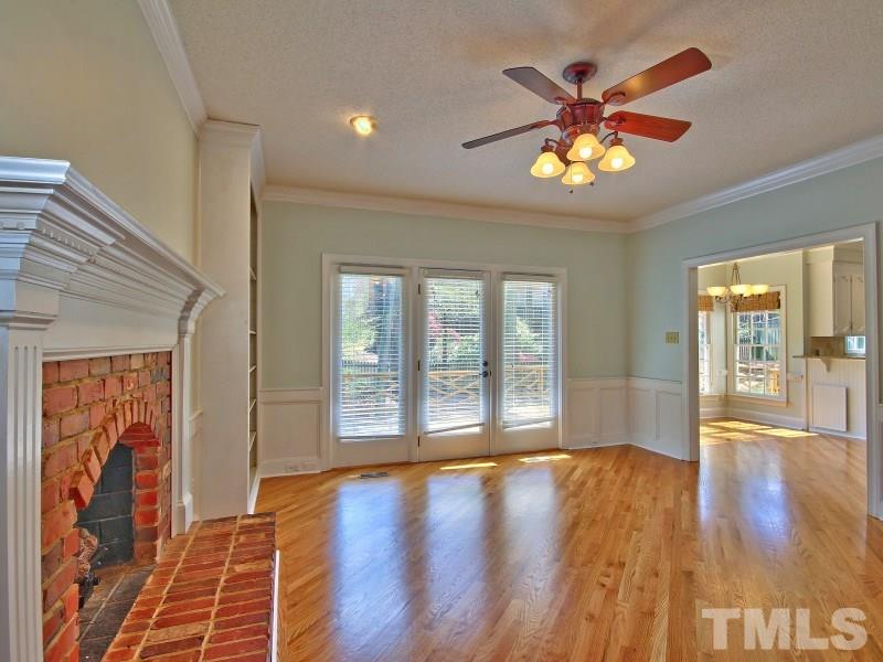 8004 Laurel Mountain Road Raleigh, NC 27613 - Photo 11 of 25 a view of an empty room with window and wooden floor