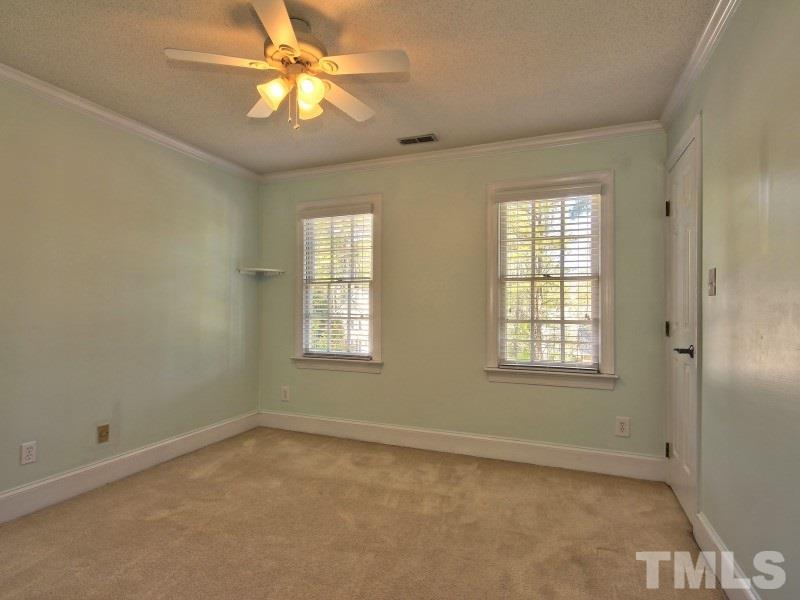 8004 Laurel Mountain Road Raleigh, NC 27613 - Photo 18 of 25 a view of an empty room with a window