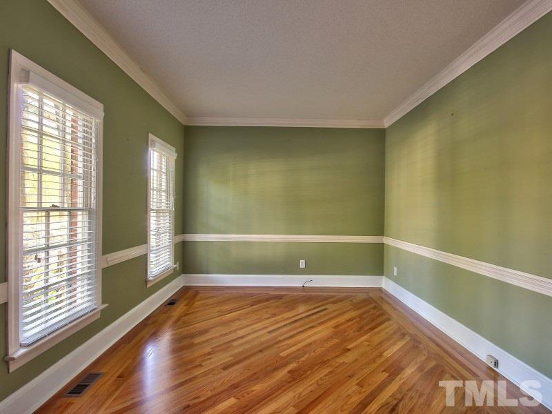 8004 Laurel Mountain Road Raleigh, NC 27613 - Photo 3 of 25 a view of room with window and wooden floor