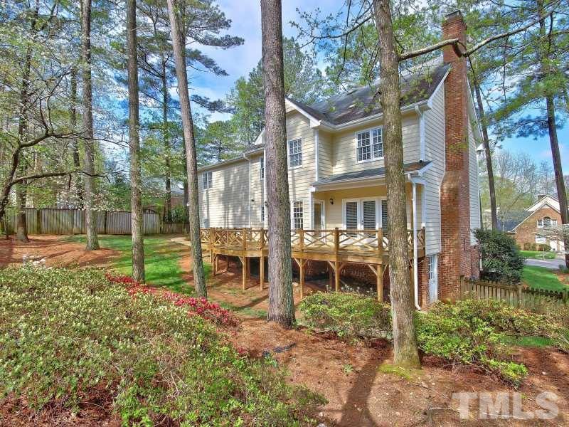 8004 Laurel Mountain Road Raleigh, NC 27613 - Photo 25 of 25 a backyard of a house with lots of green space