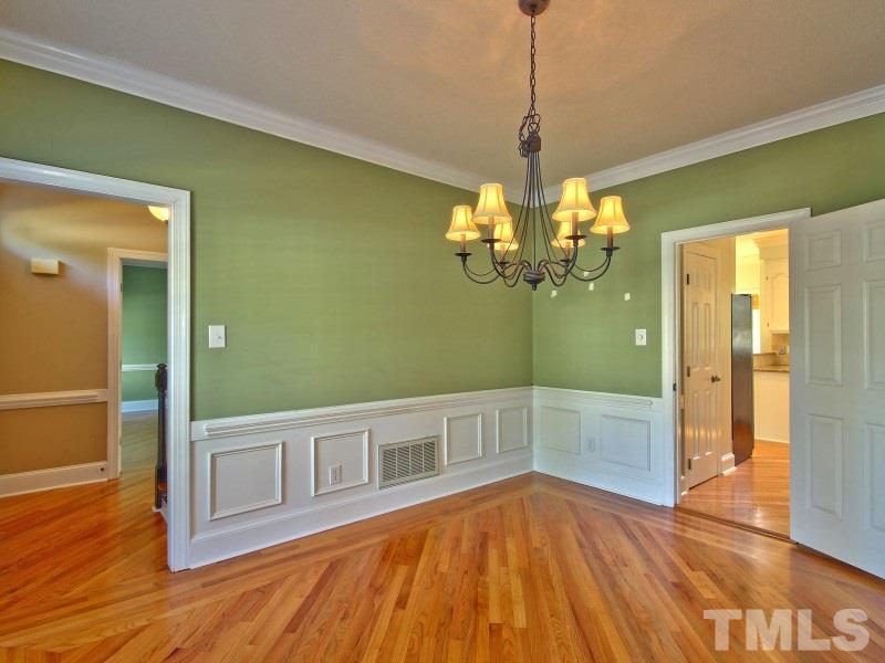 8004 Laurel Mountain Road Raleigh, NC 27613 - Photo 6 of 25 a view of a room with wooden floor and staircase