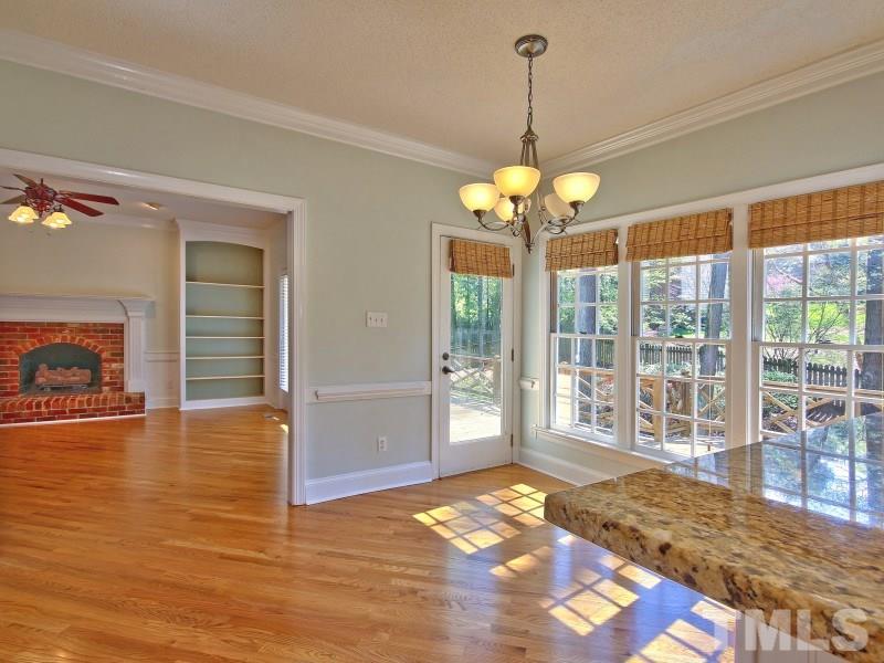 8004 Laurel Mountain Road Raleigh, NC 27613 - Photo 8 of 25 a view of a room with wooden floor and windows
