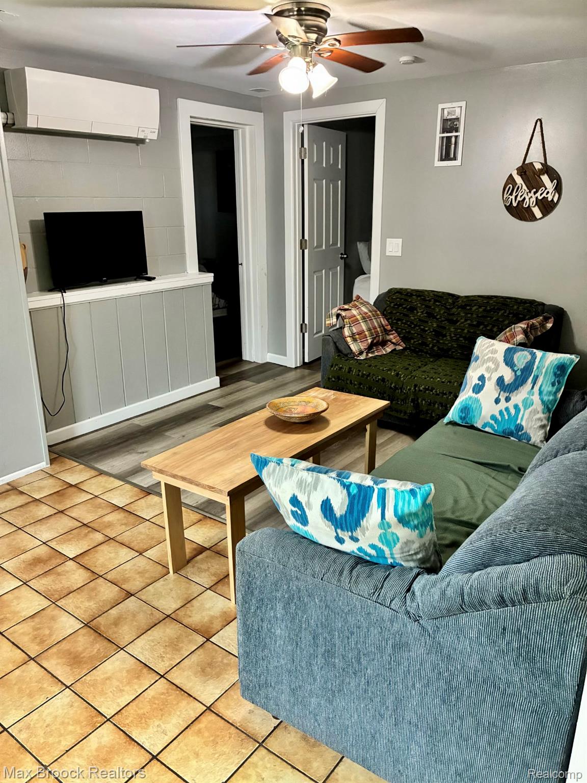 1392 Maple Grove Road Lapeer, MI 48446 - Photo 68 of 70 Living area with a wall mounted AC and ceiling fan