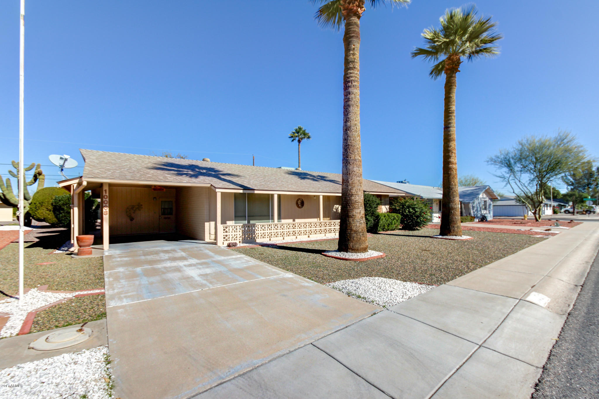 10008 West Riviera Drive Sun City, AZ 85351 - Photo 7 of 26 a front view of a building with street view