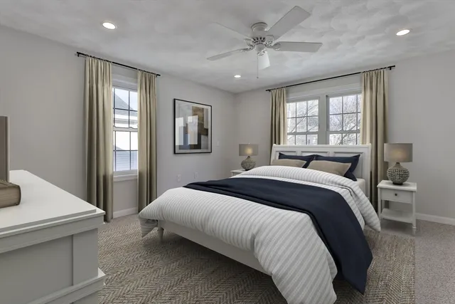 a bedroom with a large bed and a window