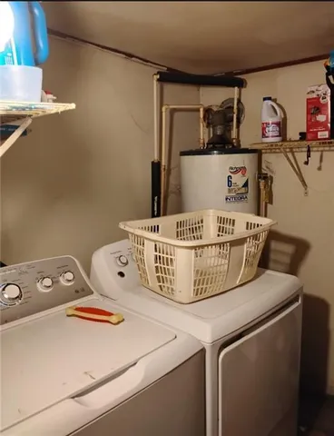 a kitchen with refrigerator and cabinets
