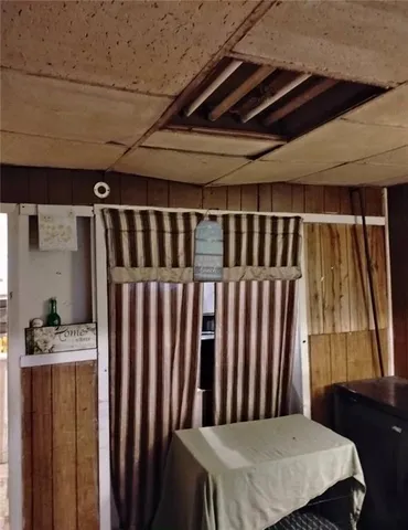 a kitchen with a wooden floor and a sink