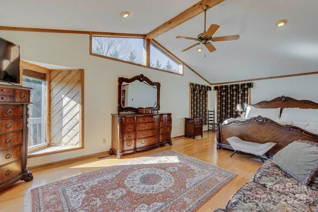 a bedroom with furniture and a window