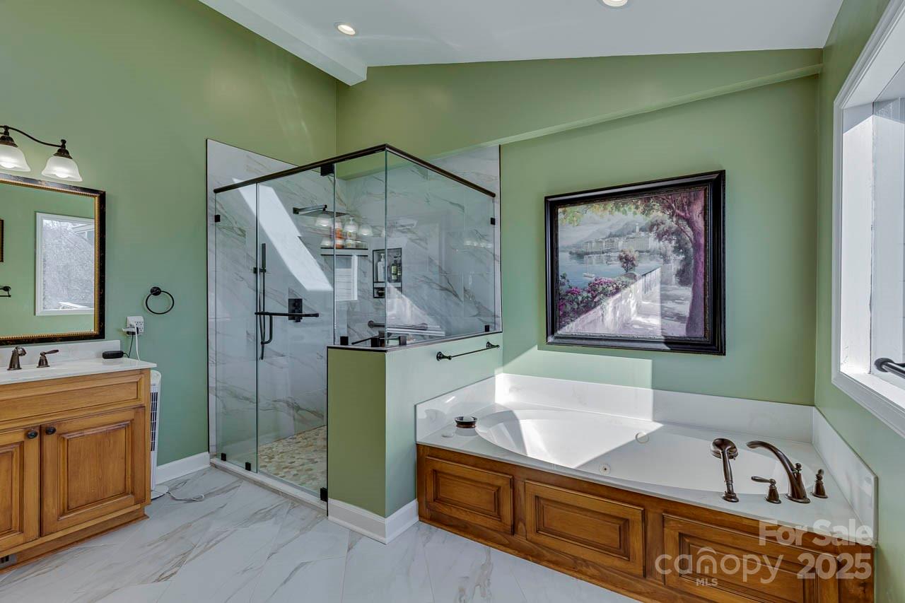 285 Old Batson Road Taylors, SC 29687 - Photo 18 of 48 a bathroom with a tub sink and mirror