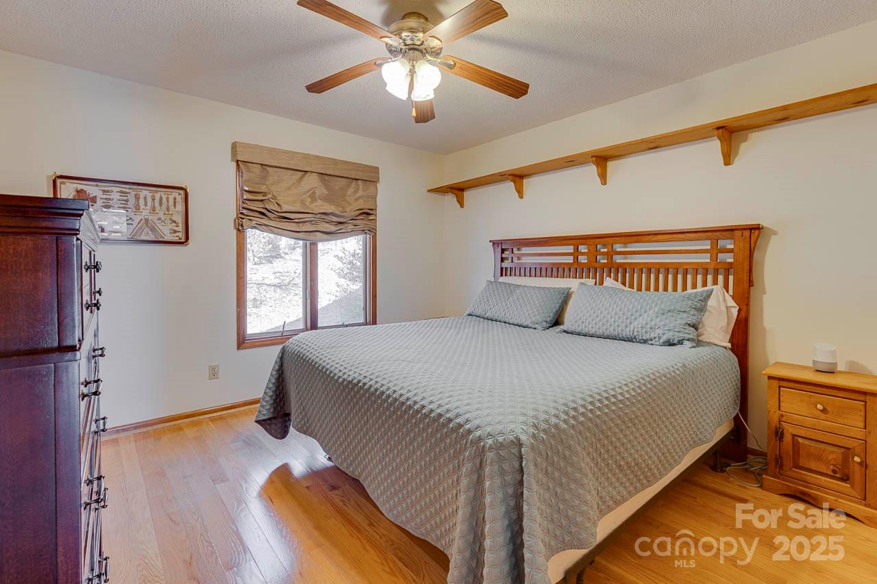 285 Old Batson Road Taylors, SC 29687 - Photo 21 of 48 a bedroom with a bed and a chandelier