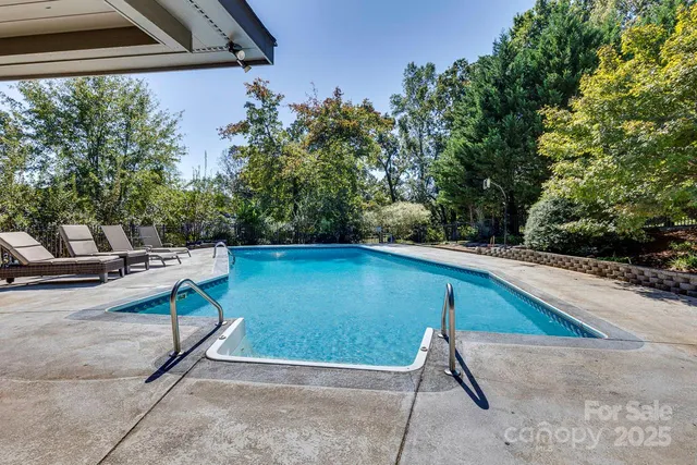 a view of a backyard with sitting area