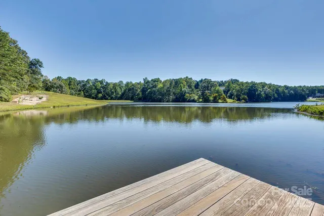 a view of a lake with a house in the background