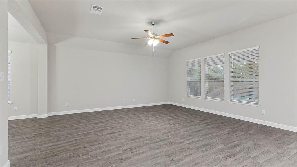 3275 Grayton Street Grand Prairie, TX 76065 - Photo 12 of 36 wooden floor in an empty room with a window