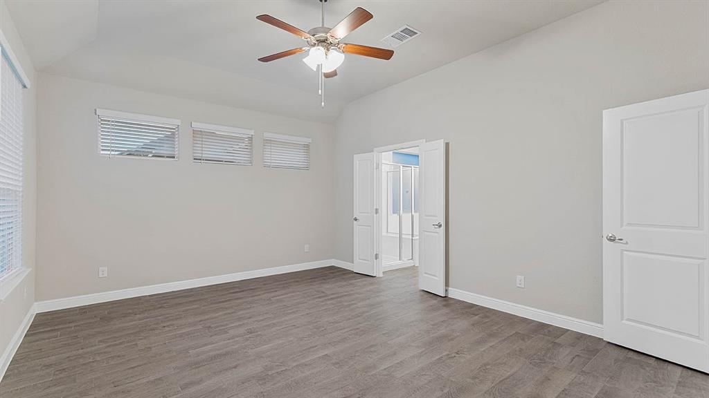 3275 Grayton Street Grand Prairie, TX 76065 - Photo 16 of 36 an empty room with wooden floor closet and fan